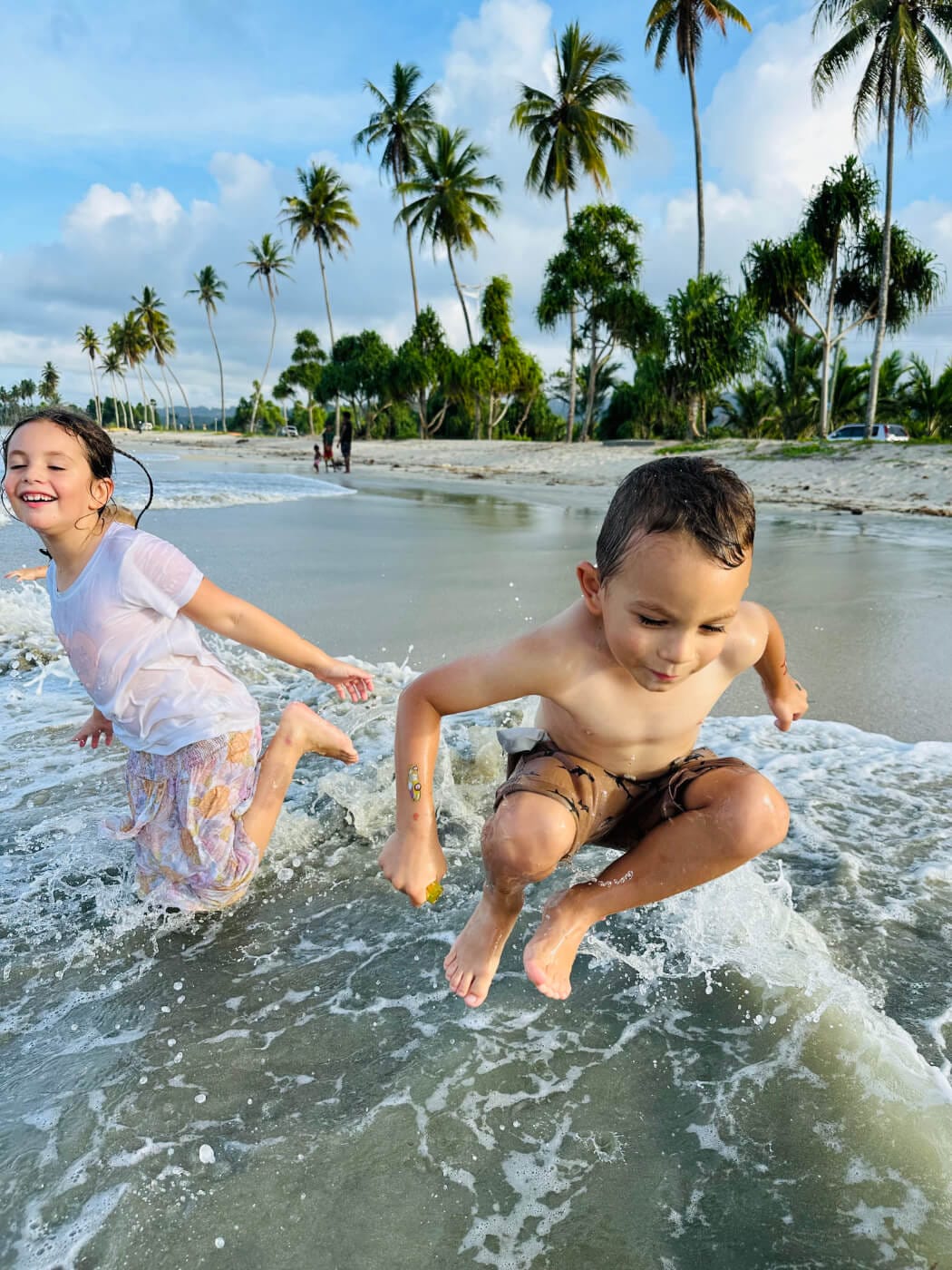 Jumping in the surf at Mani Beach, Wewak, Papua New Guinea.