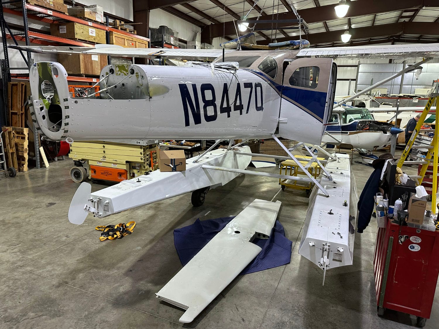 Removing the elevator, horizontal stabilizer, vertical, and rudder from a Cessna U206F to containerize it and ship it to Papua New Guinea.