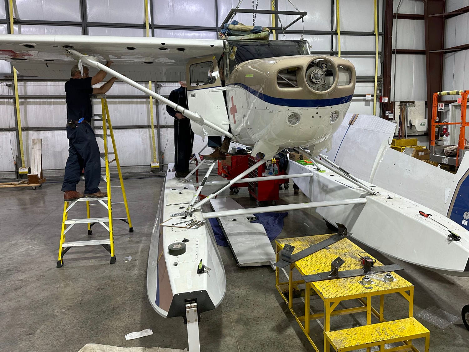 Removing wings from a Cessna U206F to containerize it and ship it to Papua New Guinea.