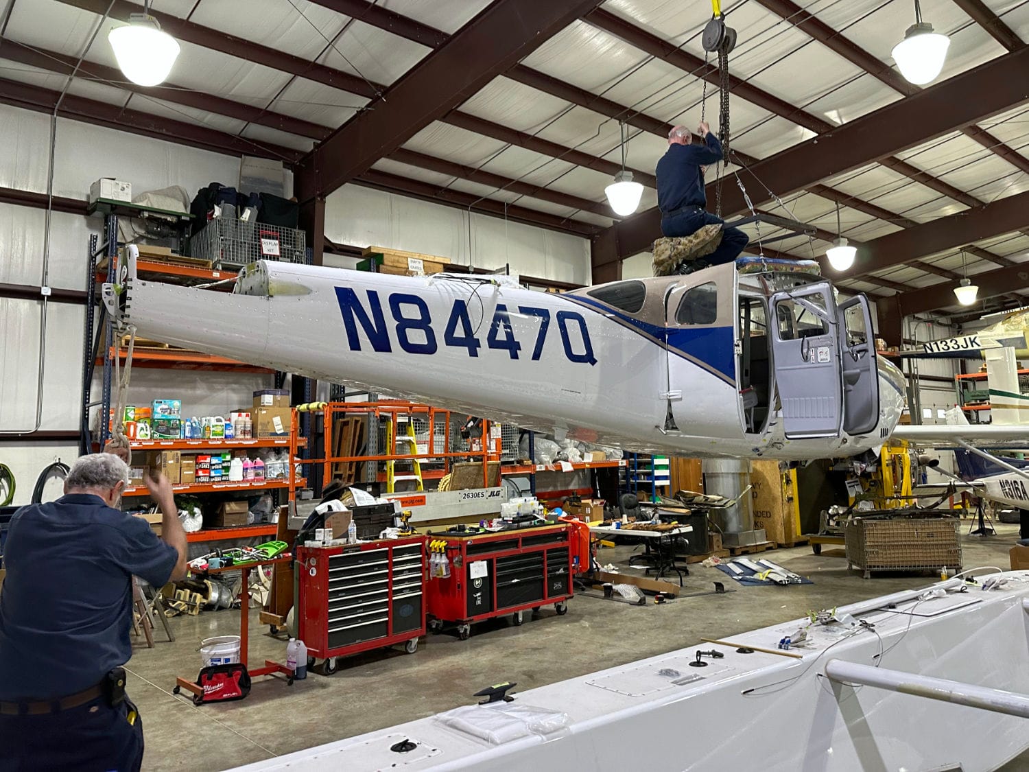 Hoisting a Cessna U206F and removing floats to ship it to Papua New Guinea.