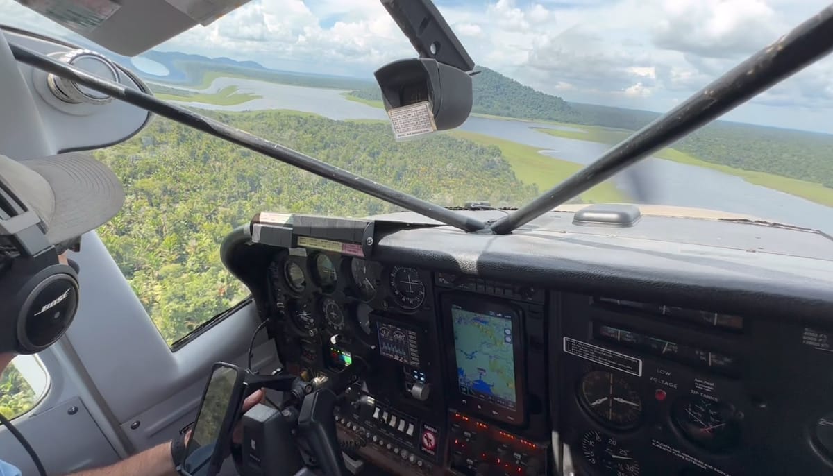 Cockpit of mission aviation floatplane flying above Chambri Lakes in Papua New Guinea